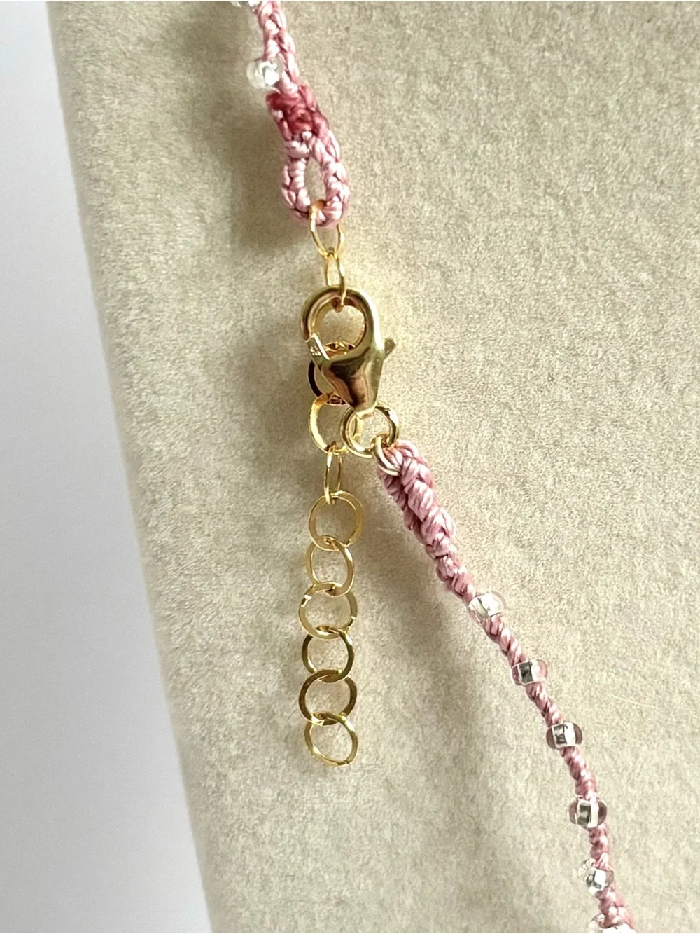 Pink silk thread necklace with a beautiful pink coral briolette stone
